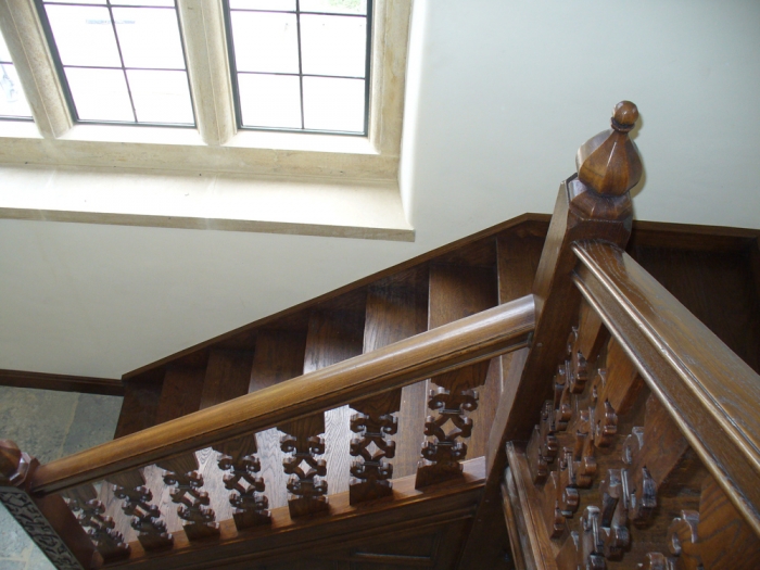 Oak Staircase with Hand Carved Newels and Finials, together with Fretted Splats