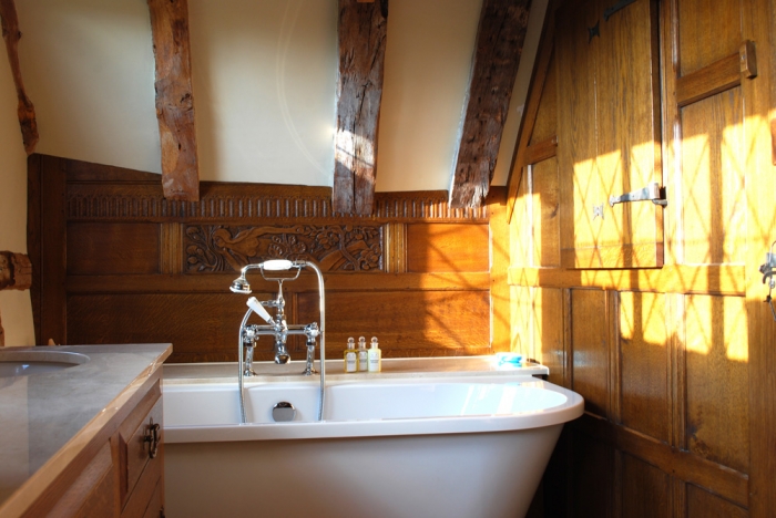 Oak Panelled Screen with Boarded Door and Window Shutters, the Bath Panel has been Scribed to fit the ceiling and beams