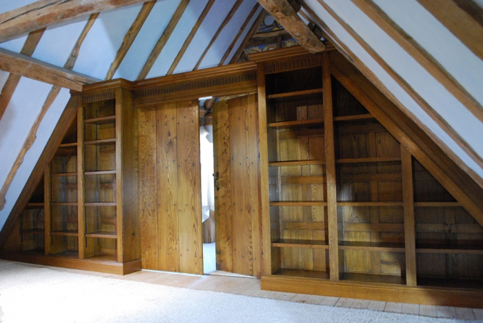 Panelled Oak Bookcase Screen with a pair of Boarded Doors and Hand Carved Rails with a Large Cornice