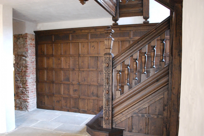 Solid Oak Wall Panelling with a Jib Door and a Hand Carved Frieze and Solid Oak Staircase with Hand Carving