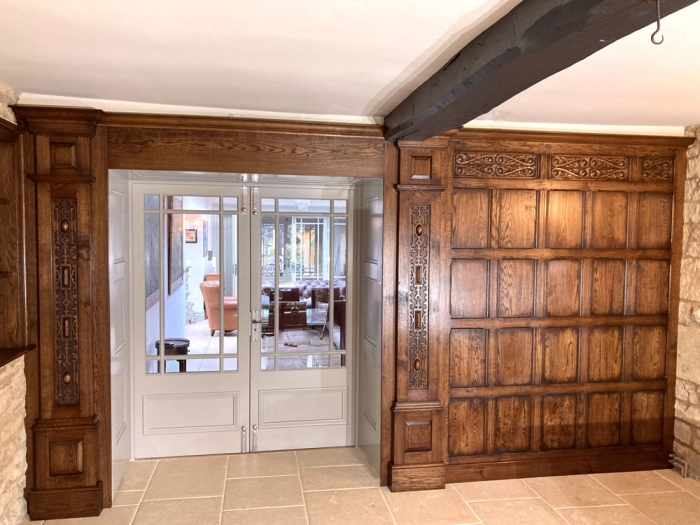 Oak panelling with a hand carved frieze and columns
