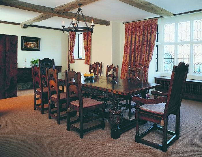 Fully Carved Refectory Table with Carved Cup and Cover Legs inlaid with Walnut and Sycamore. A set of Late 17th Century Yorkshire Chairs and a pair of Heavy Carved Panel Back Armchairs