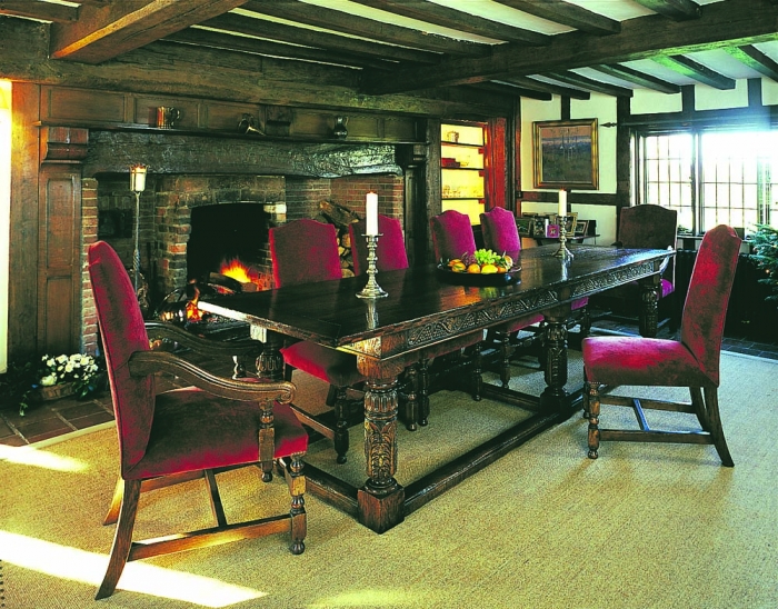Fully Carved Oak Refectory Table with Carved Cup and Cover Legs and Grape Vine Carved Rails with a set of Fully Upholstered Chairs