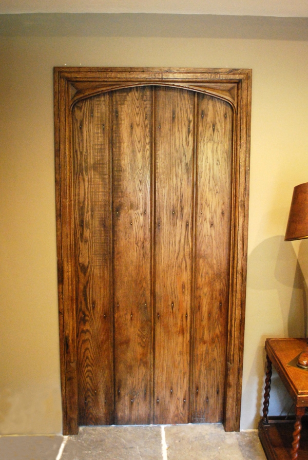 Oak Boarded Door with Hand Carved Frame and Moulded Architrave