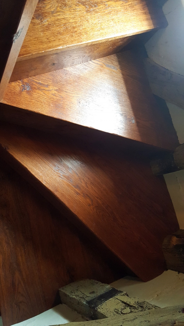 Oak Treads and Risers scribed around the walls and timber framing