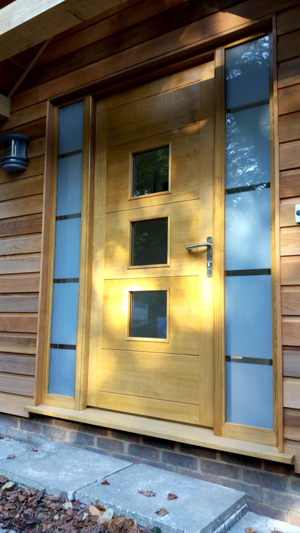 A Contemporary Oak Front Door with Etched Glass Sidelights