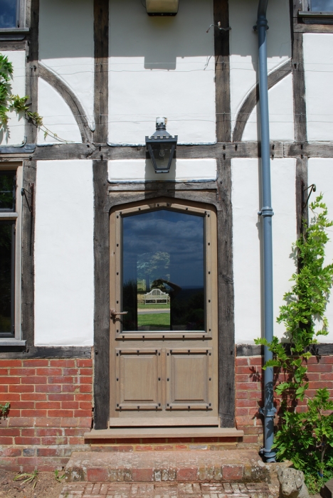Solid Oak Half Glazed Door with a Bronze Casement Double Glazed Unit and Hand Made Brass Door Furniture