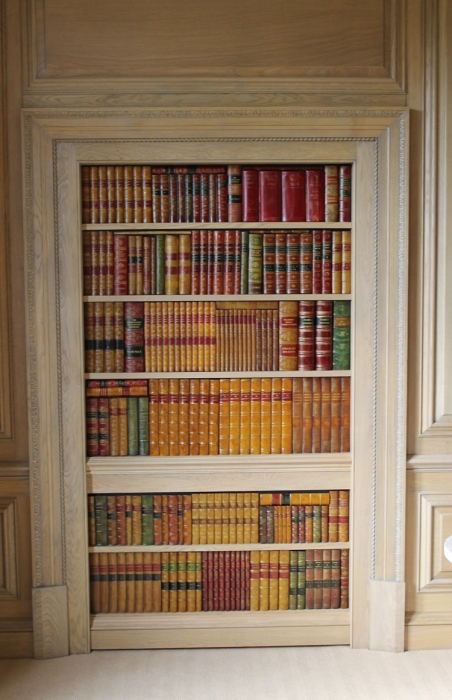 Secret Library Door with Faux Books and Elaborate Carved Surround