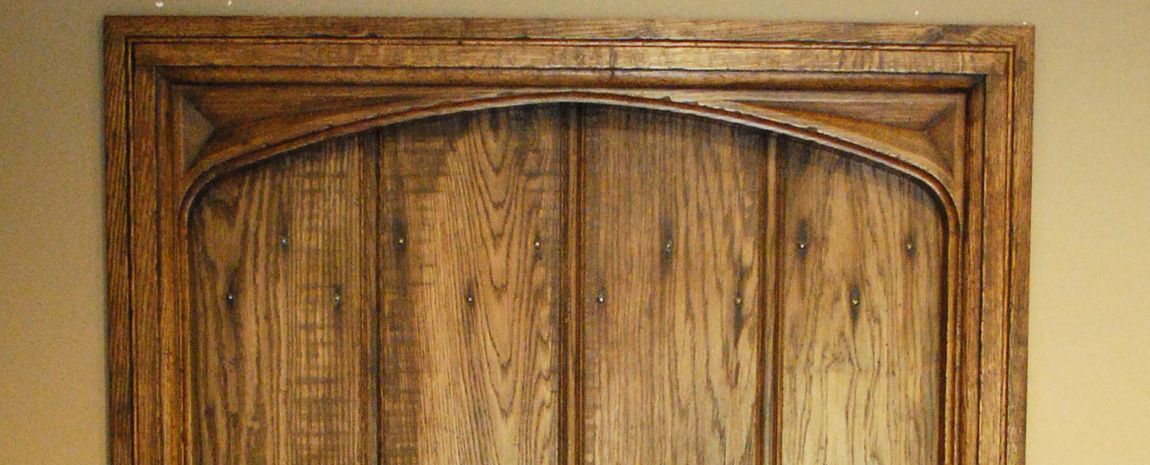 Shaped Boarded Door with Hand Carved Spandrels
