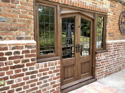 Oak Patio Doors with Linenfold panels and opening Lead Light side Windows
