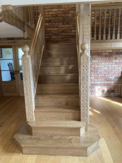 Oak Staircase with Bullnose Steps and Hand Carved Newel Posts